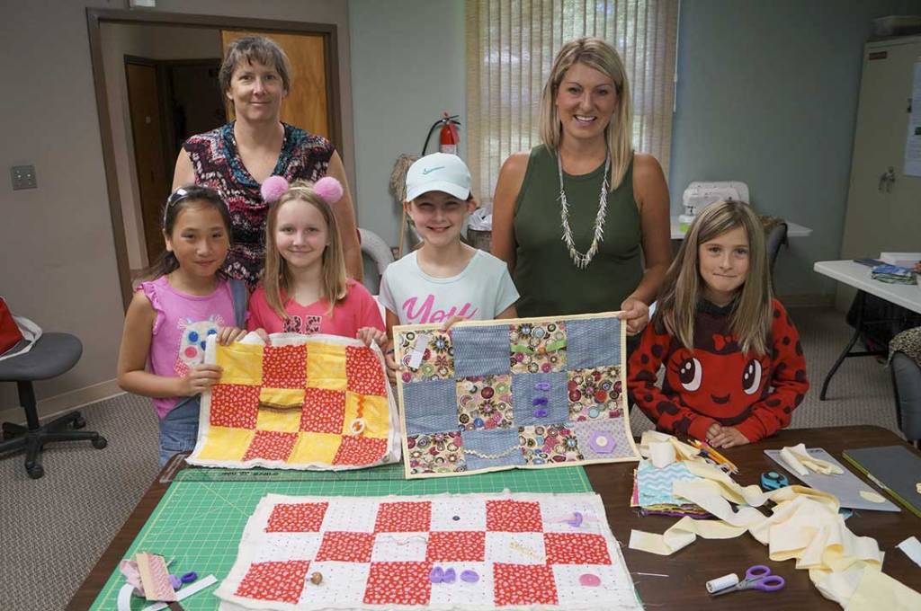 Assiginack summer camp sews Widget quilts for Alzheimer’s Society